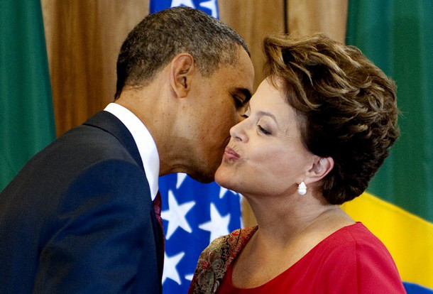 US President Barack Obama (L) kisses Brazilian President Dilma Vana Rousseff (R) during a joint press conference at Palacio do Planalto in Brasilia on March 19, 2011. AFP PHOTO/Jim WATSON (Photo credit should read JIM WATSON/AFP/Getty Images)